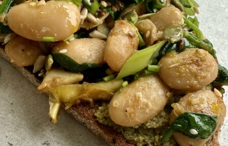 Emma's miso beans artichoke hearts on pesto toast